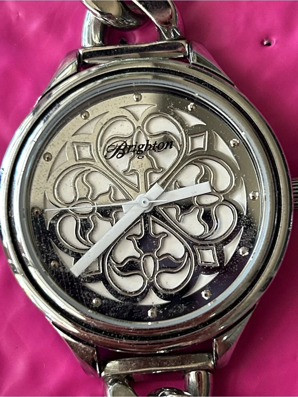 Brighton chain-link watch showcasing the ornate, scrollwork cut-out motif